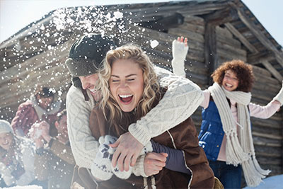 adults having fun in the snow