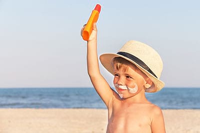 Cute child with sunscreen